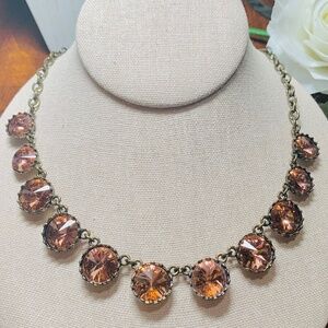Gorgeous faceted Rose Pink glass set in an aged gold vintage necklace.